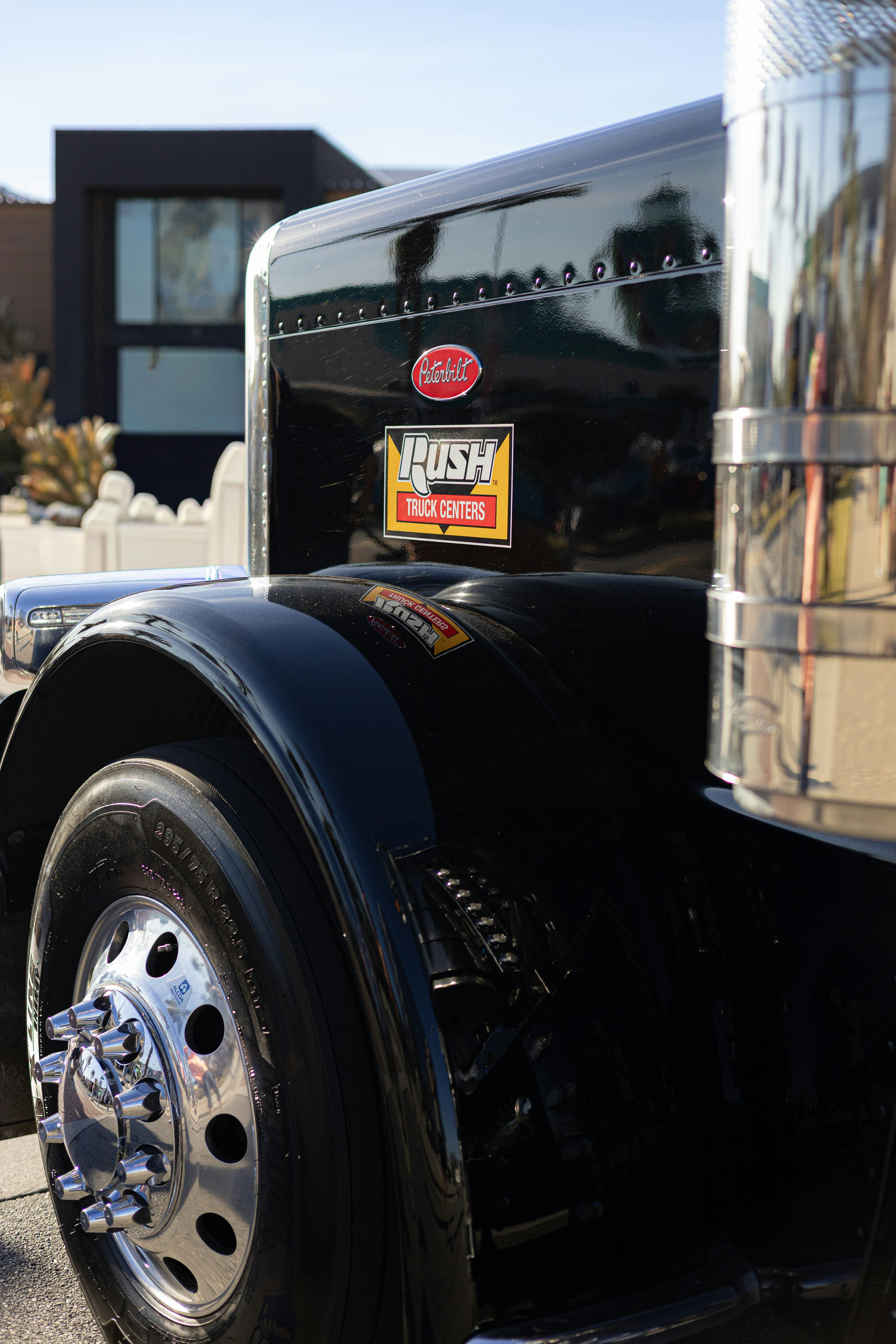 Close-up of a shiny black semi-truck