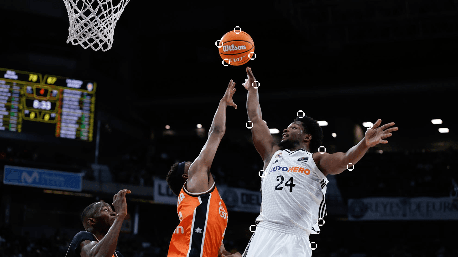 Two basketball players in an official match