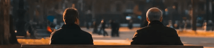 A wide banner image shows two figures walking through a sunlit park with golden autumn trees, used as the background for a video preview.