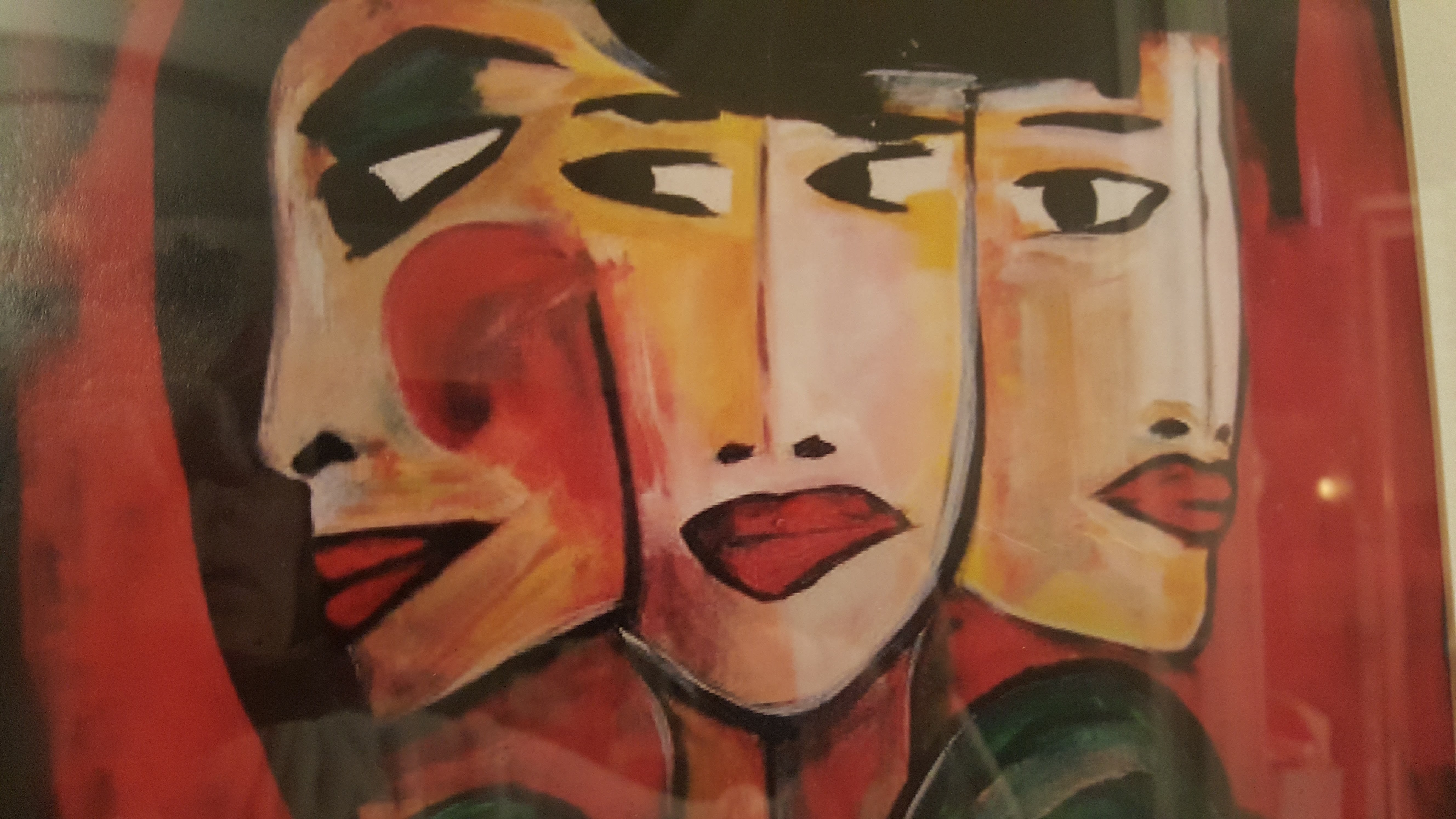 painting of three women's faces all close to each other