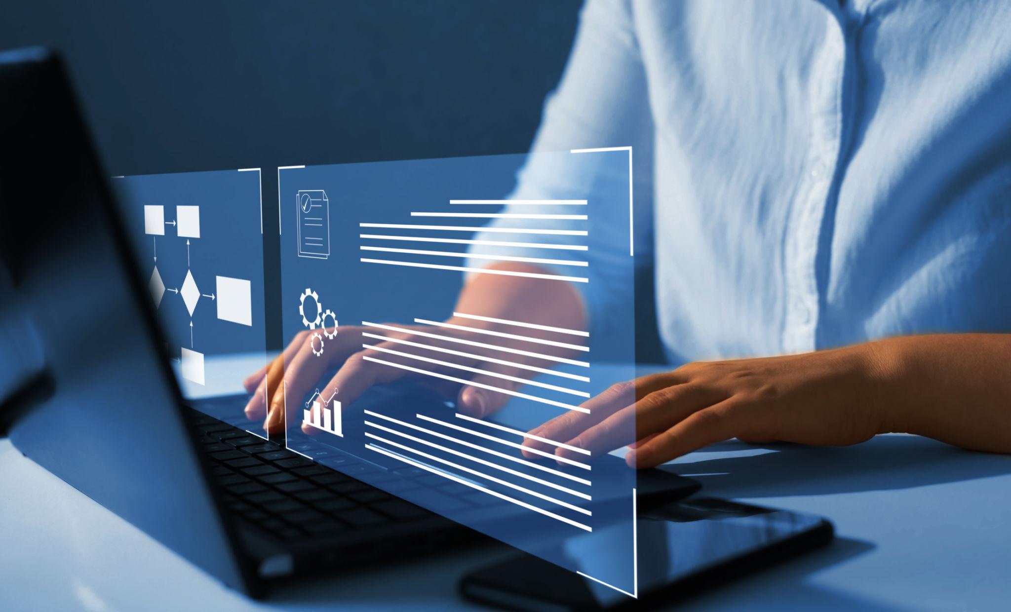 Business woman operating a laptop
