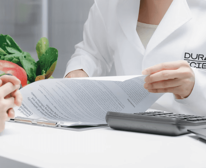 a woman sitting at a desk using a computer
