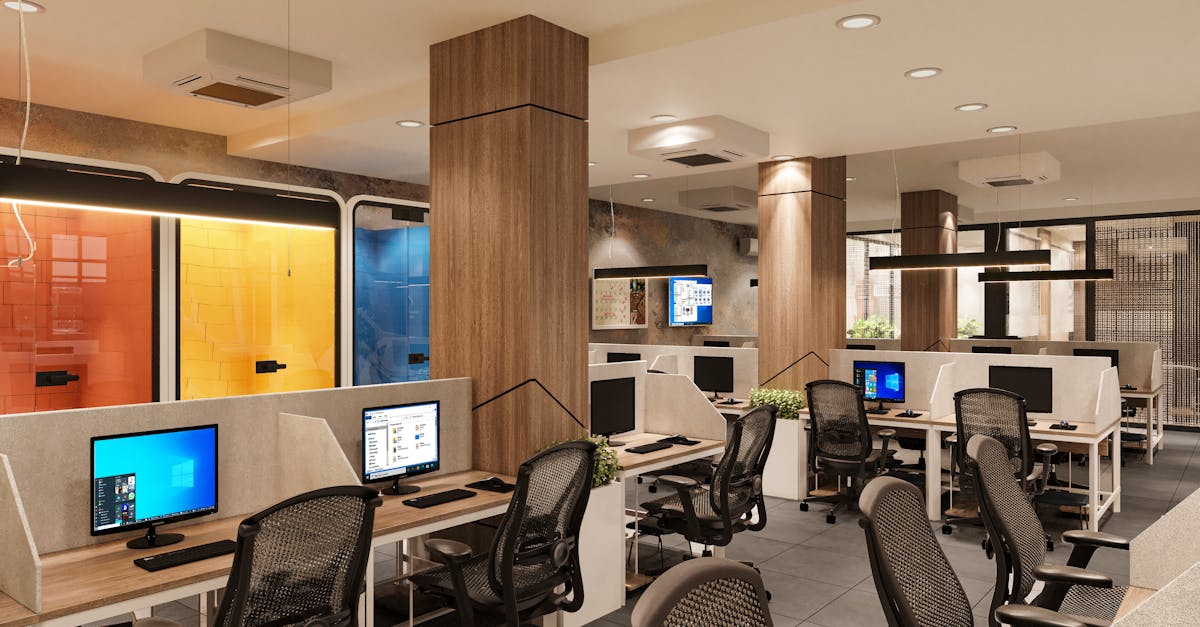 Bright and spacious modern open office interior with workstations and colorful elements.