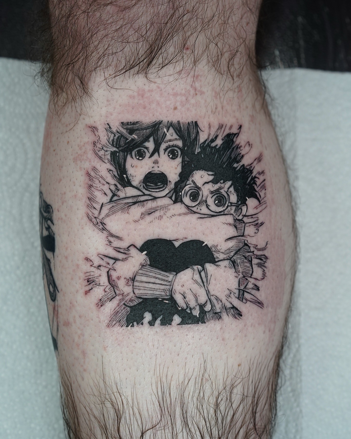 This manga-style tattoo captures an emotional moment with Momo fiercely embracing Okarun, her protective instincts on full display. The delicate black-and-grey shading adds depth to the characters’ expressions, highlighting their determination and fear. The fine linework mimics the texture of manga panels, making this piece a perfect homage to Dandadan fans who love its dramatic storytelling.