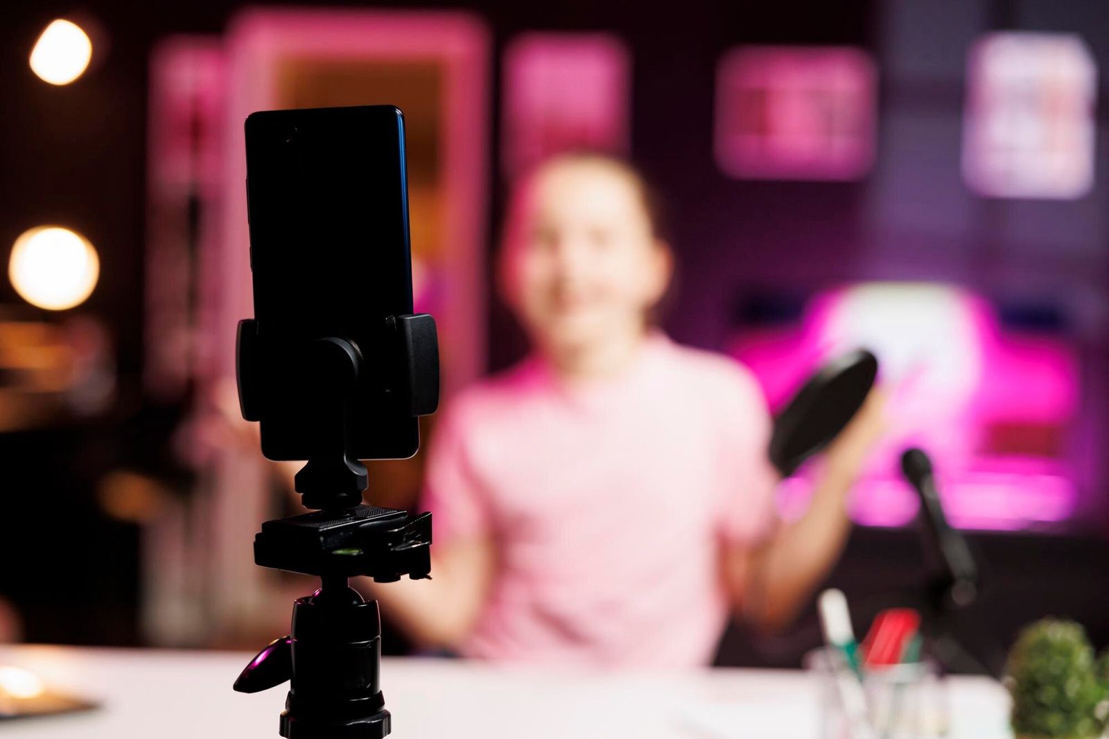 Smartphone recording a woman presenting for social media