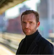 man wearing black notched lapel suit jacket
