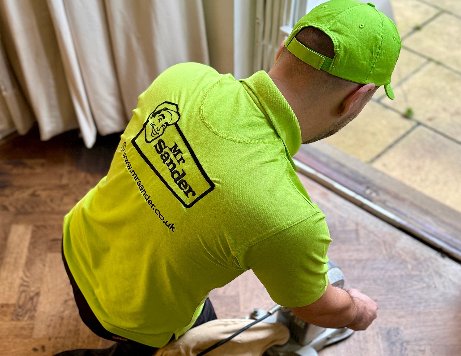 Photograph showing Mr Sander logo embroidered onto a work shirt