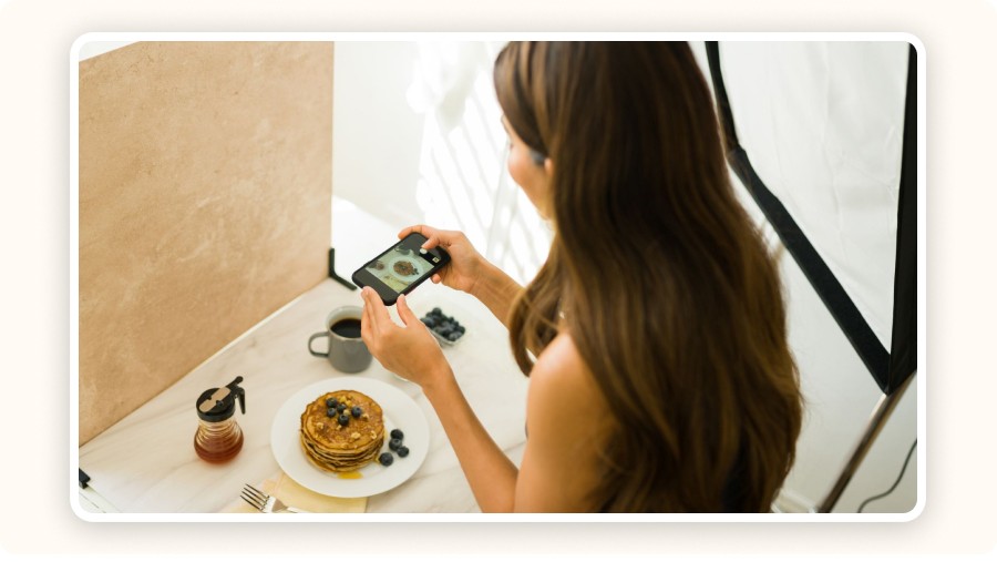 Woman taking a photo of pancakes