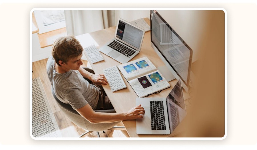 Person working across multiple screens