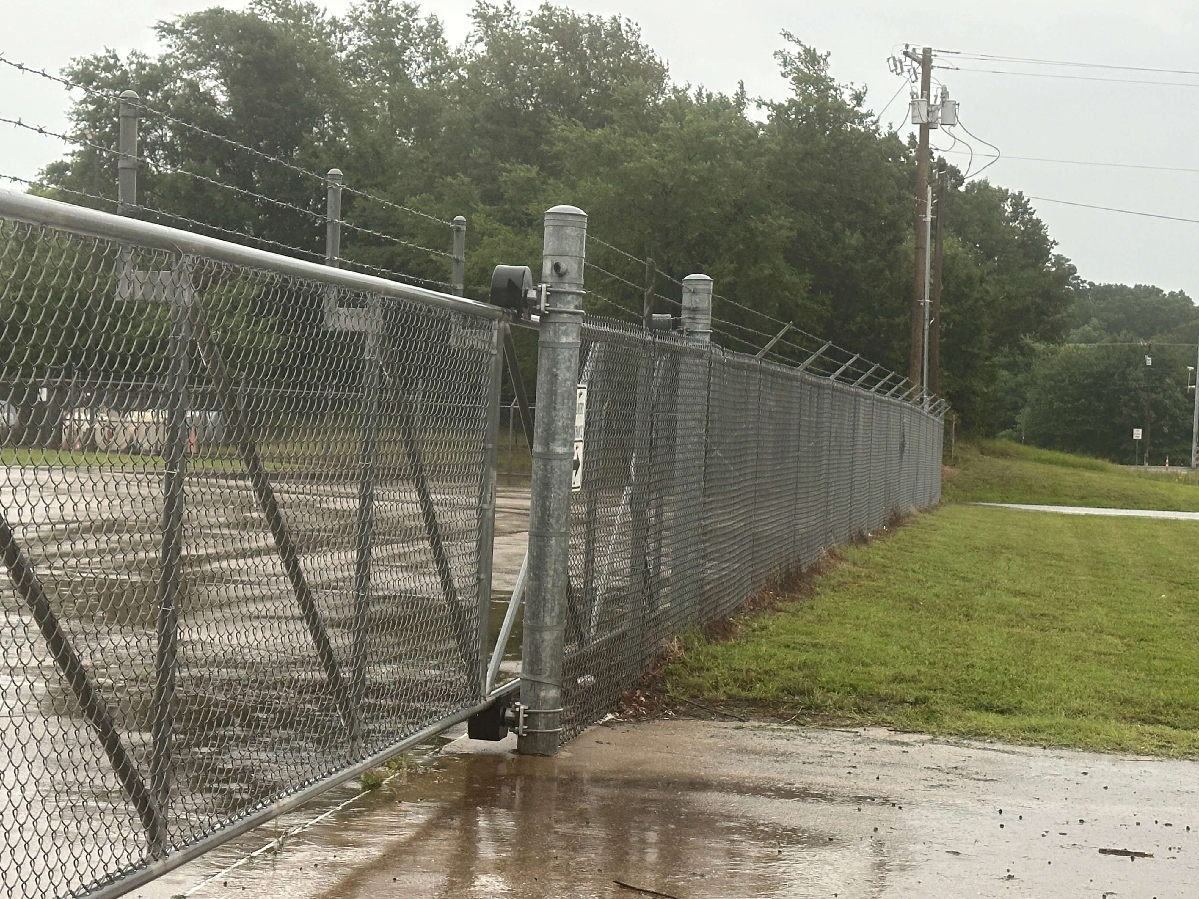 This picture shows a roller gate in a security fence with razor wire at the top that we can install around properties.  We also run security fencing from our welding and fabrication shop in Henderson, Texas.