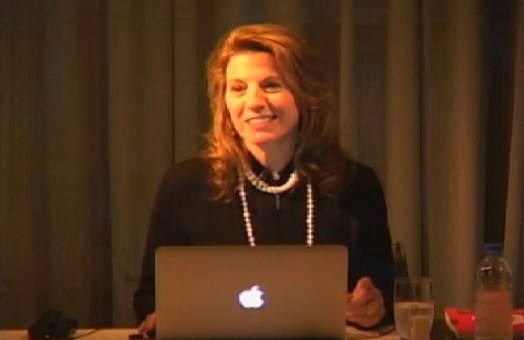 portrait of a woman in front of a Mackbook