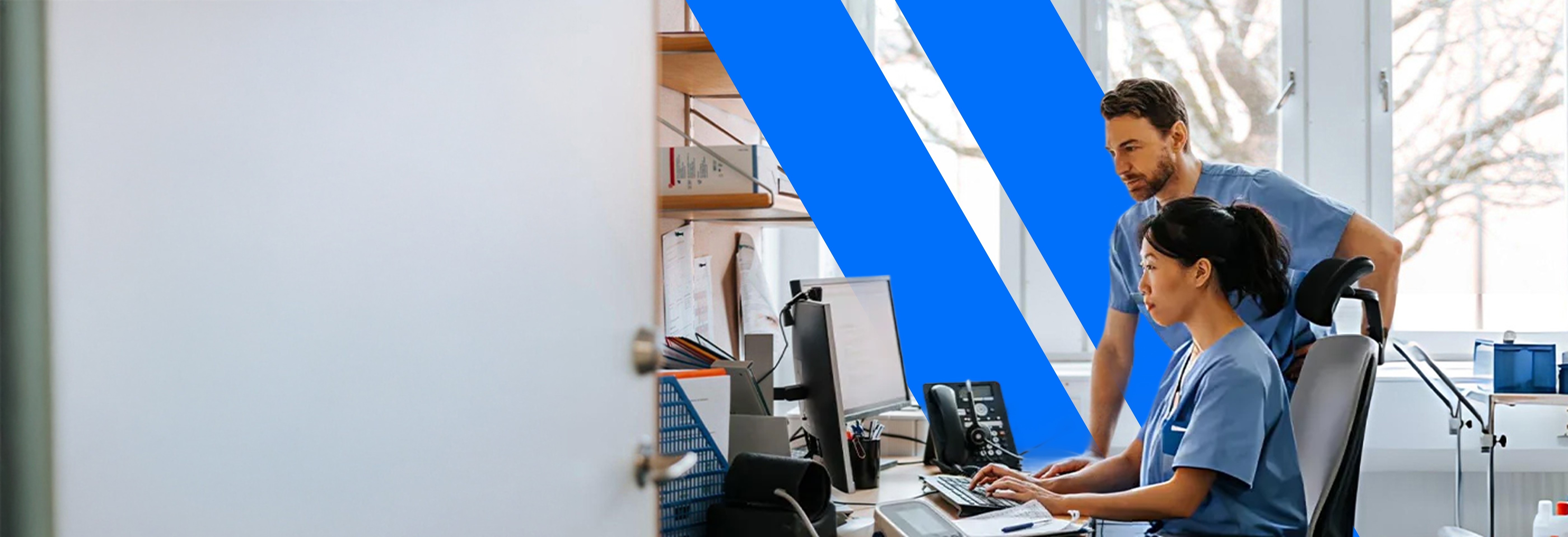 woman holding a phone and man looking at the phone. both are smiling