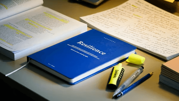 High school student conducting political science research with a PhD mentor in a university setting