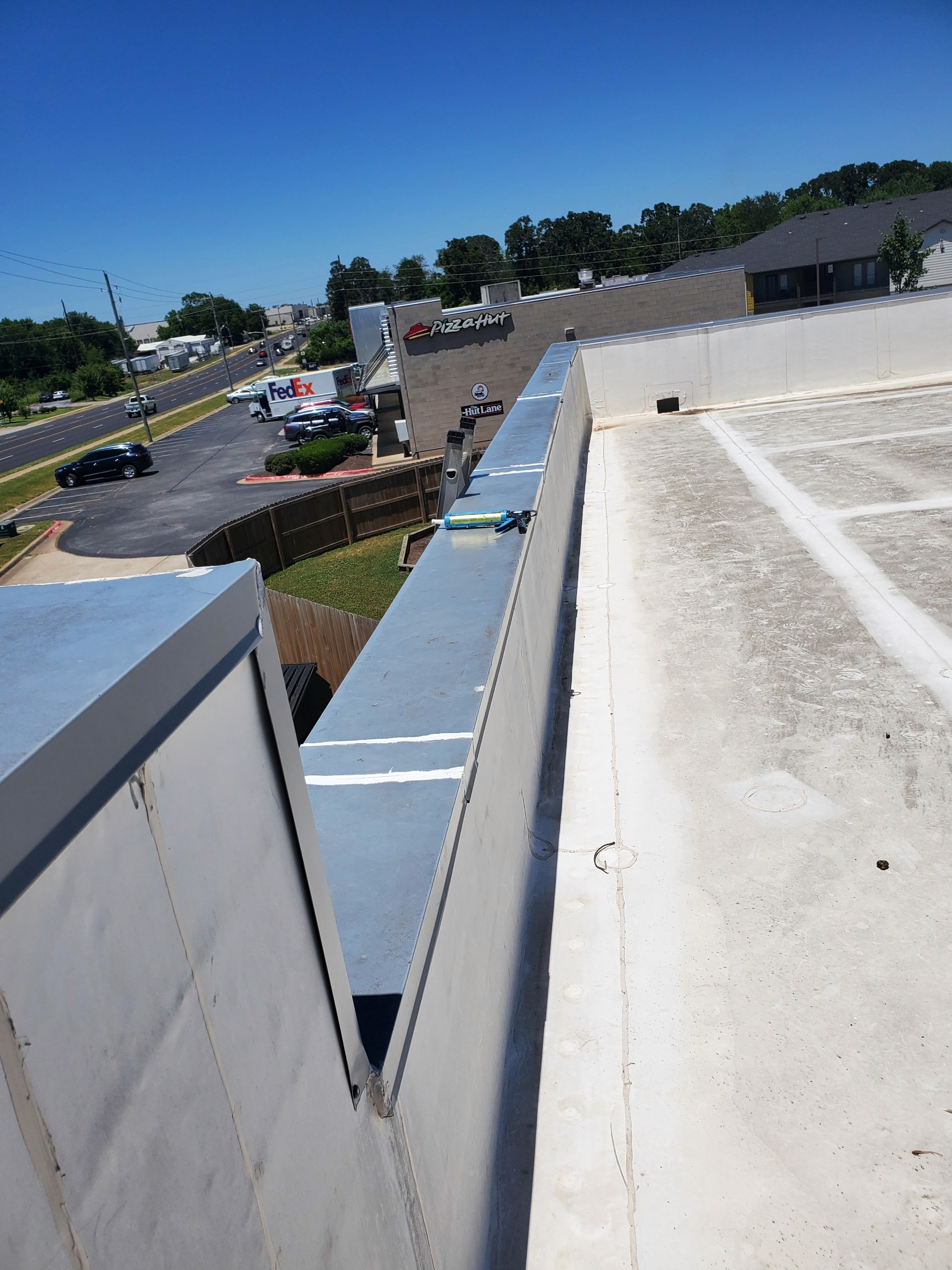 Commercial Roofing - TPO Roof Re-sealing Cap that was leaking 