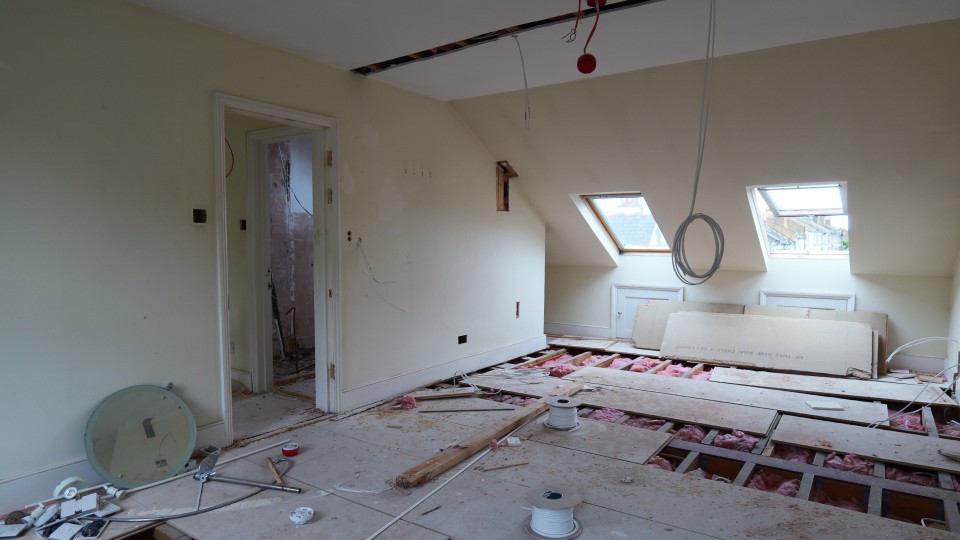 Top floor HMO conversion works with exposed floor joists and electrical preparation