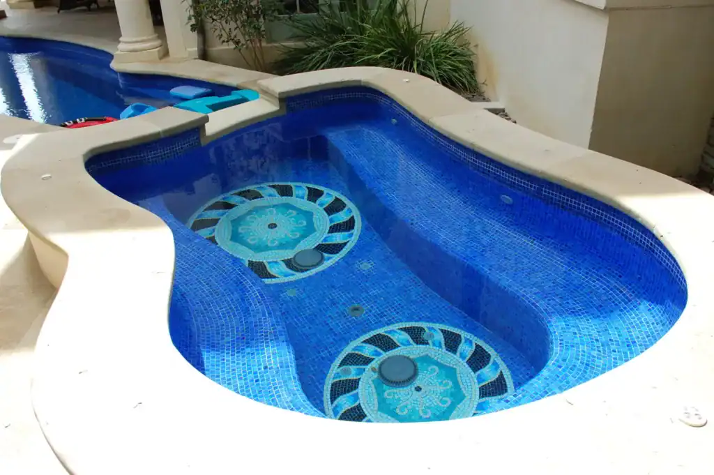 Mosaic mosaic glass pool with intricate geometric design, perfect for outdoor luxury pools.