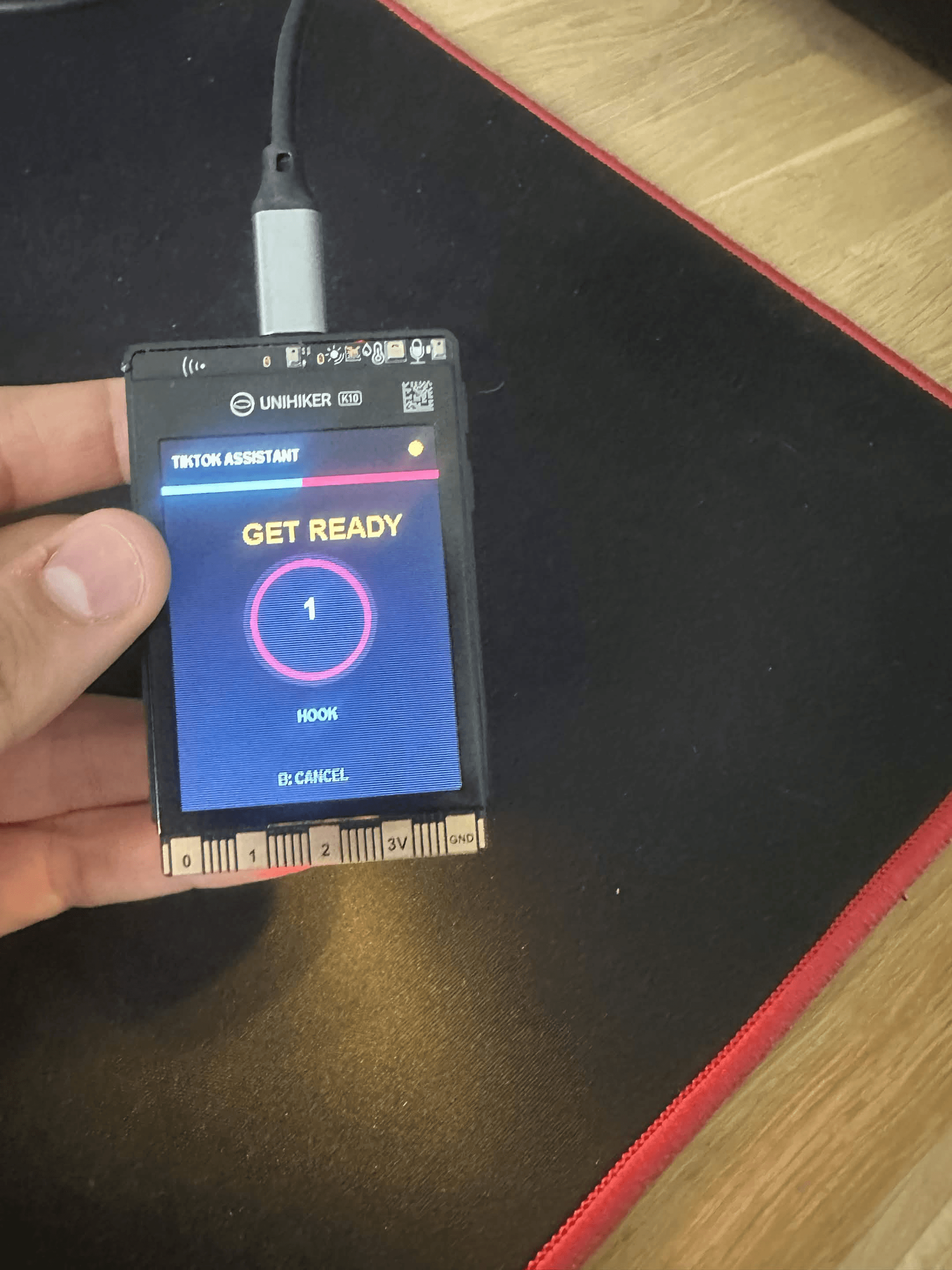 Smart TikTok filming assistant running a countdown and recording timer on the UNIHIKER K10.