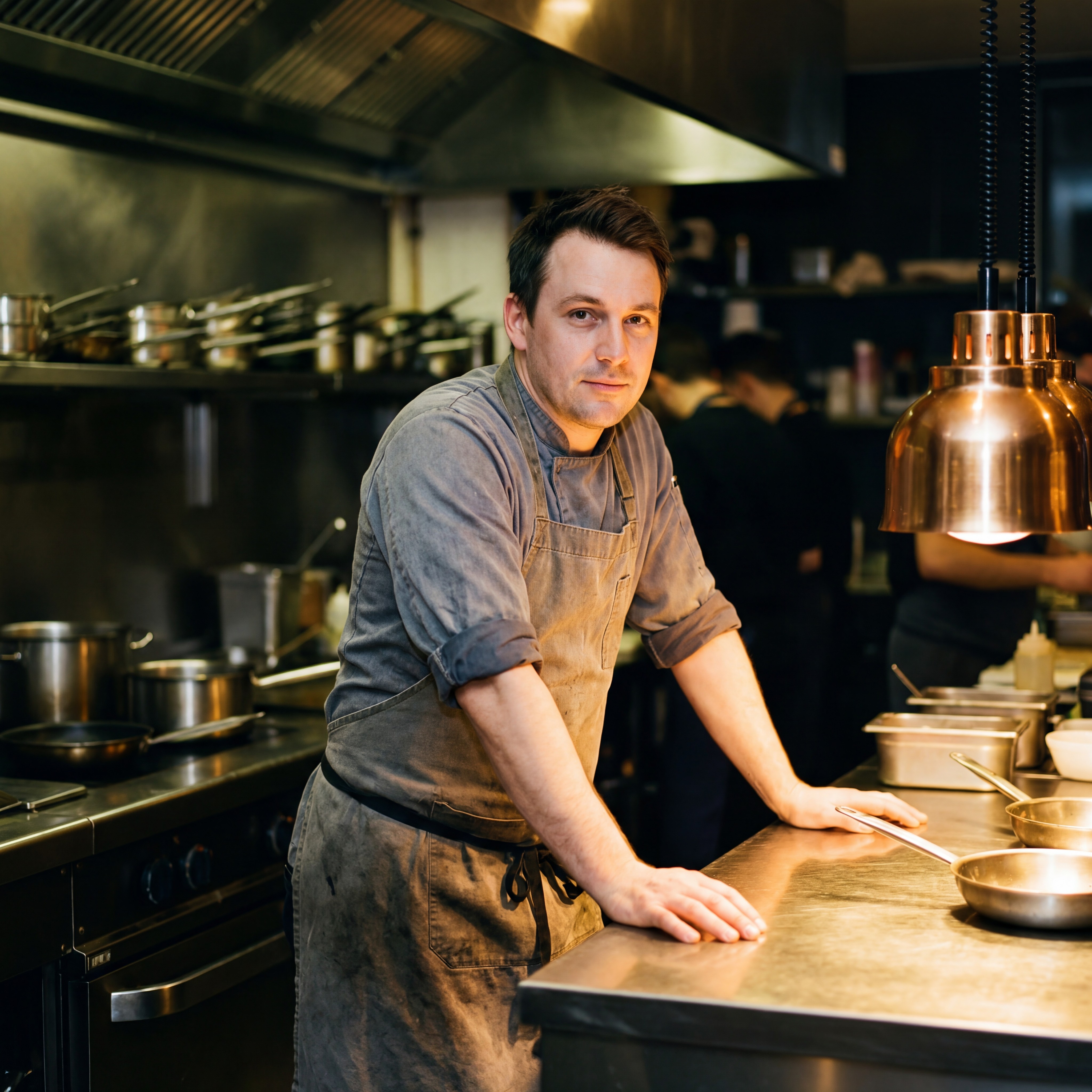 Waitress using Stampede tablet POS system taking orders from group of happy restaurant guests dining with wine and shared plates