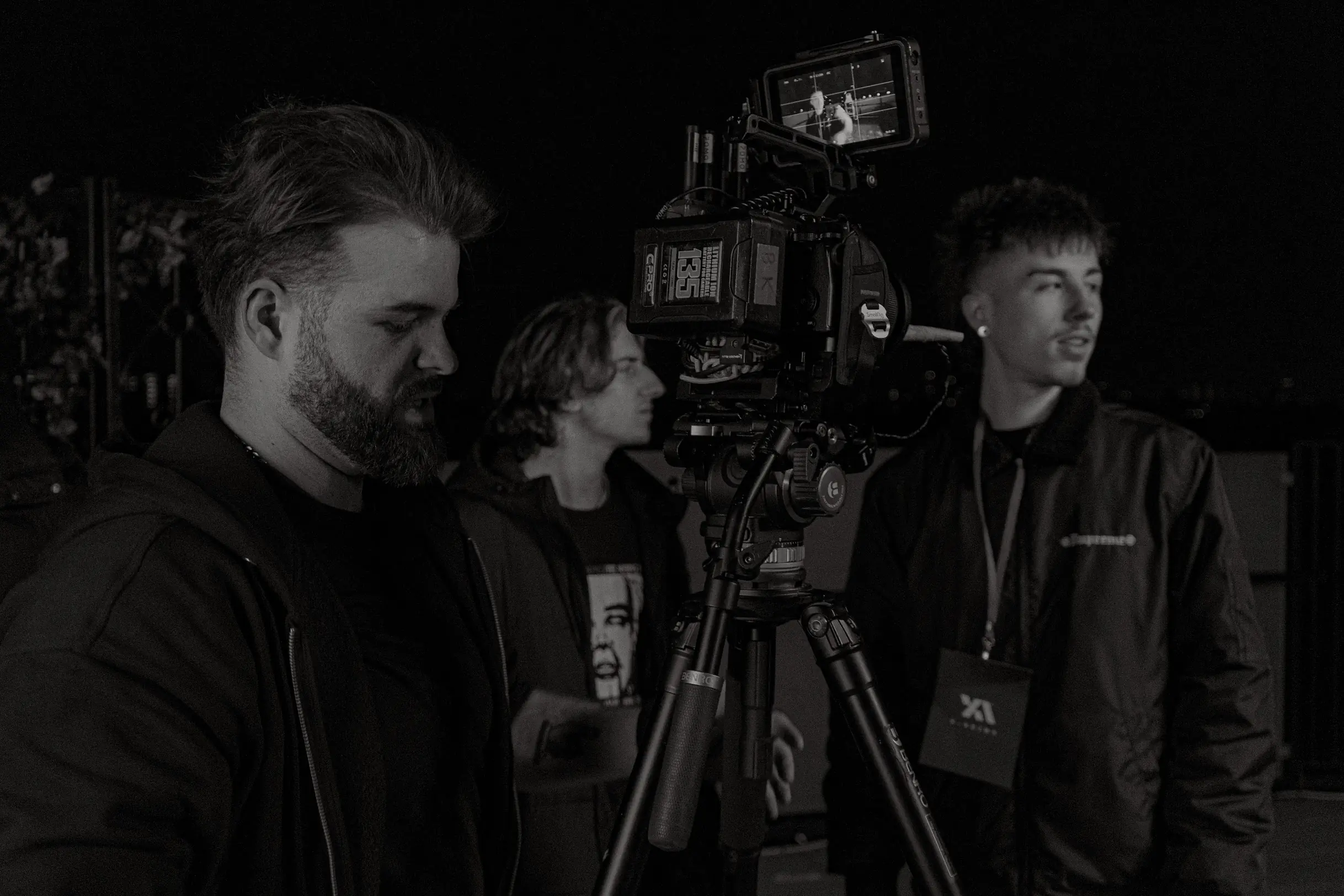 Three people behind the scenes at an X Anima shoot