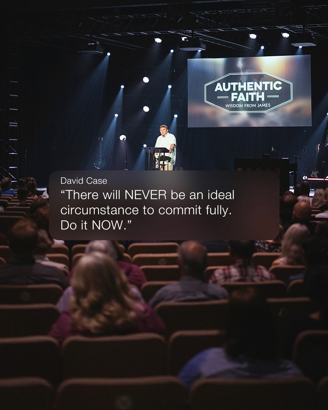 Round black-and-white outdoor sign mounted on a white bracket against a green background, featuring a white globe grid logo on a black face.