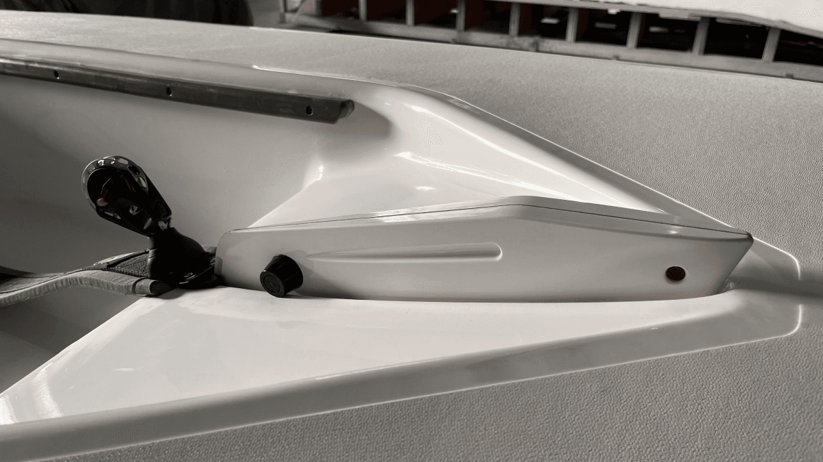 a person swimming in the water with grass