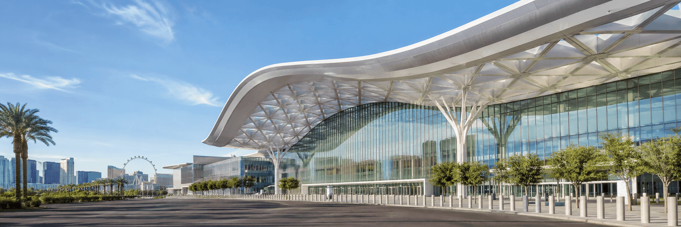 Dark professional Las Vegas Convention Center booth planning hero image with modern venue exterior, glass facade, and Las Vegas skyline
