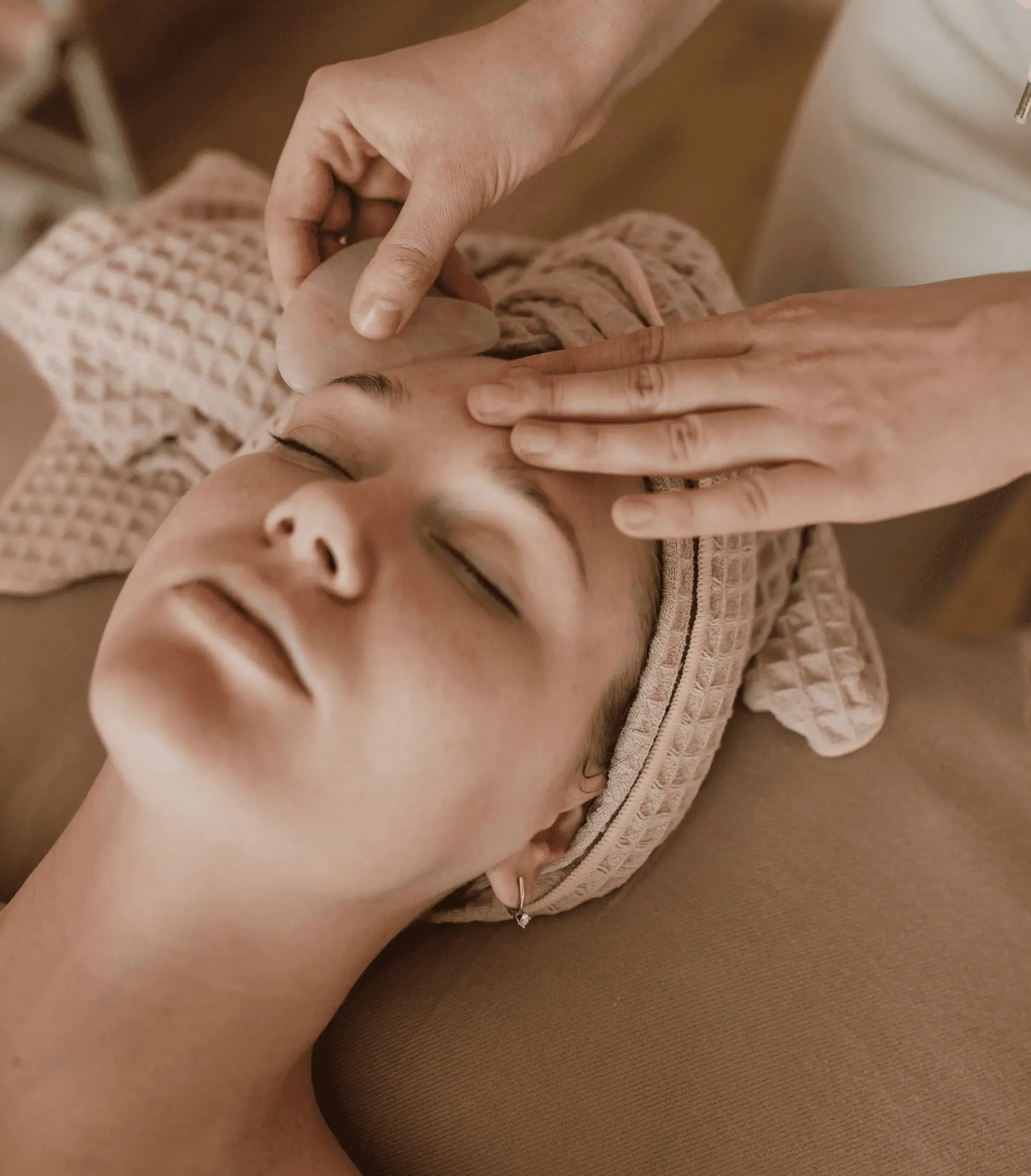 Client relaxing during HIFU skin tightening session aimed at improving firmness, reducing wrinkles, and restoring even skin tone.