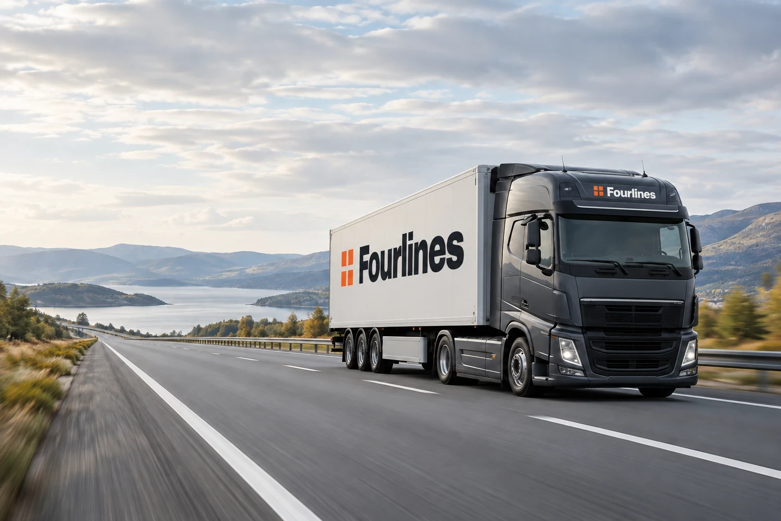 Fourlines branded freight truck with a pale trailer travelling on a quiet highway beside hills and water