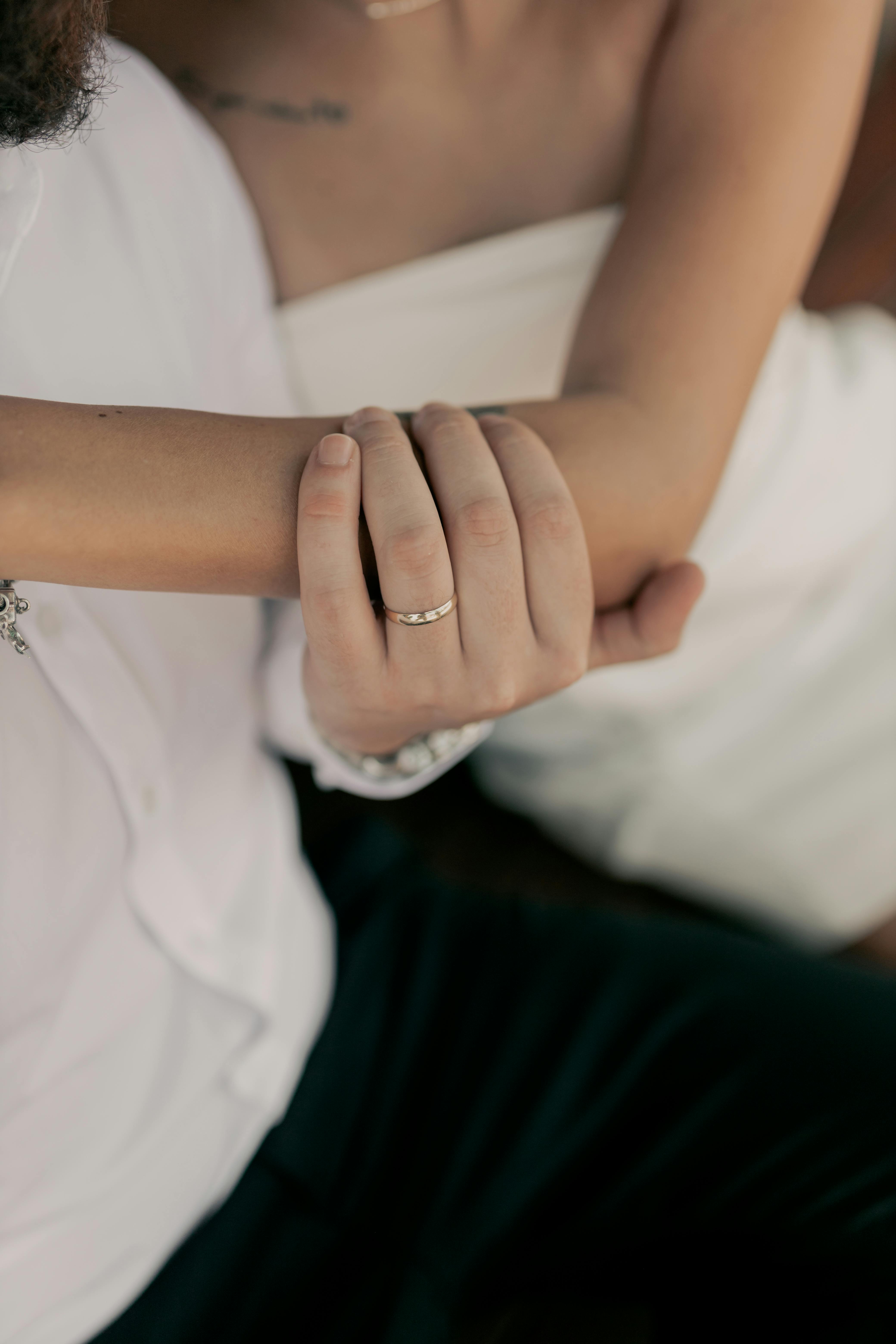 Photo by Alexander Mass: https://www.pexels.com/photo/close-up-of-couple-holding-hands-with-rings-29484004/