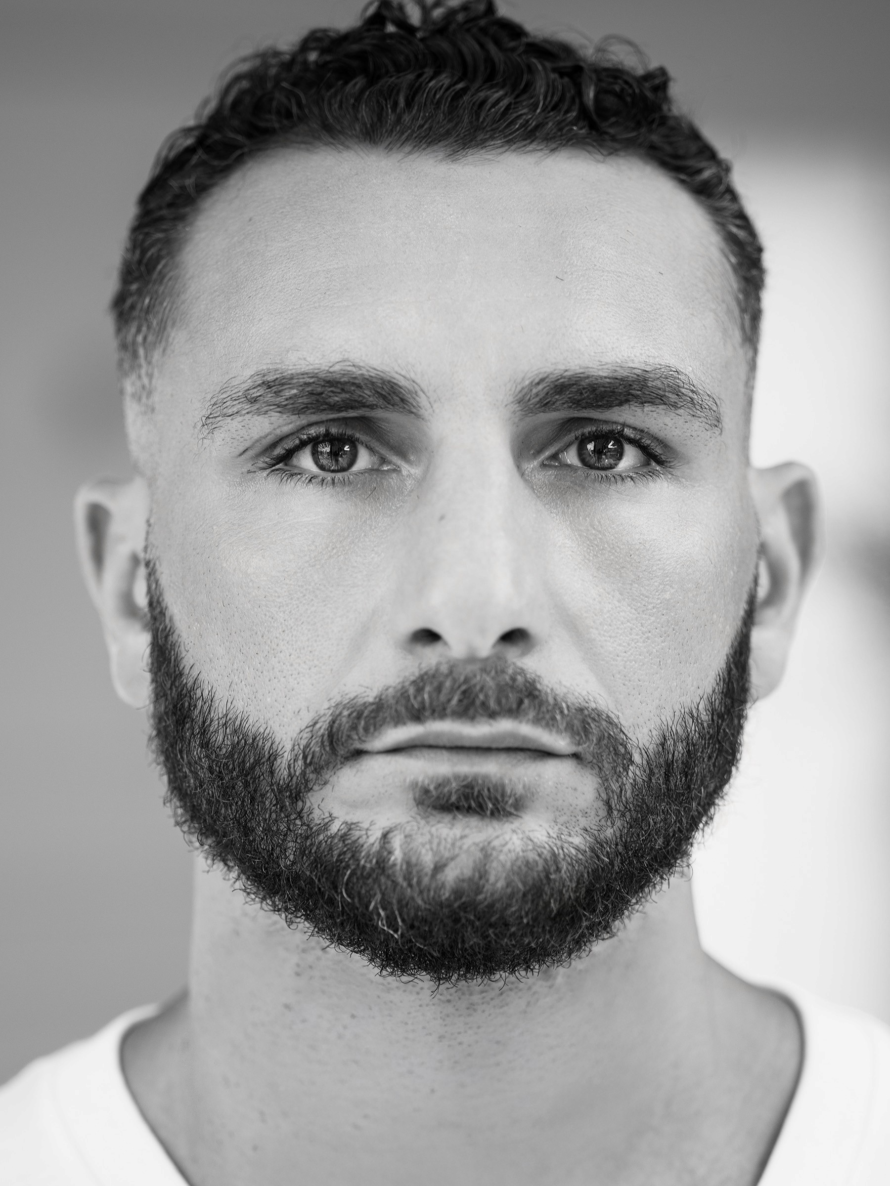 Faces of Impact 100 Honoree - Noel Mikaelian - Black and White Portrait by Artem Shestakov