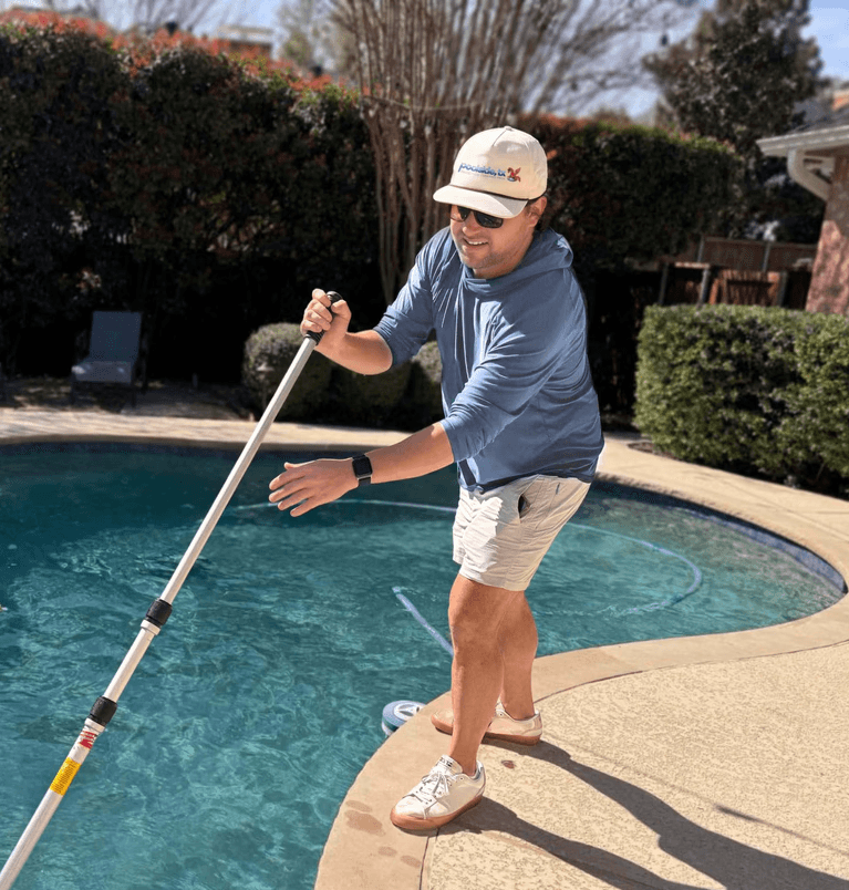 Plano pool being cleaned by technician from Poolside, TX pool service