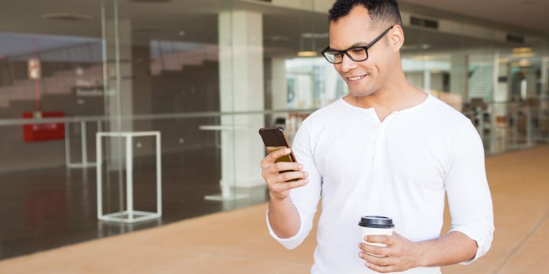 A smiling potential customer getting a lunch promo through SMS