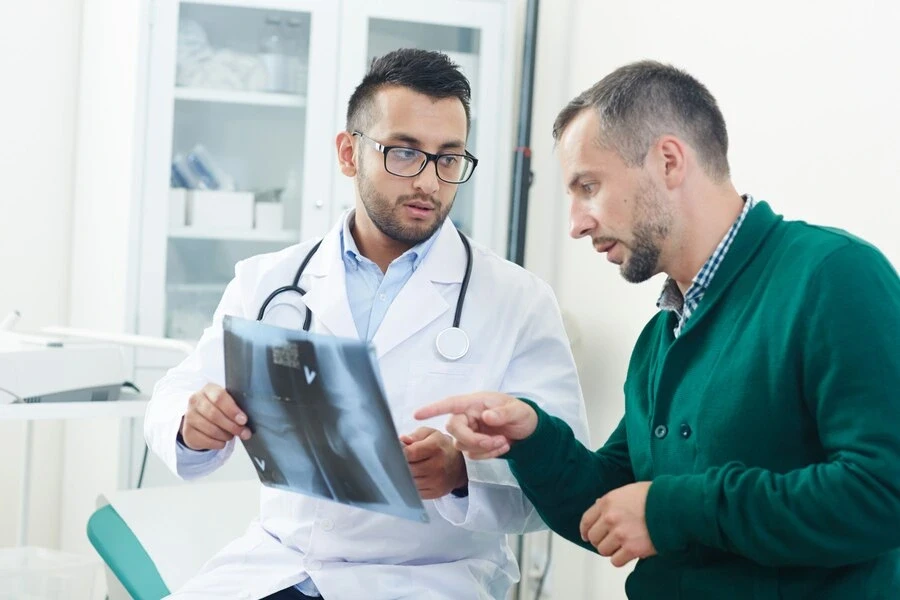 dr discussing the X-ray report with patient