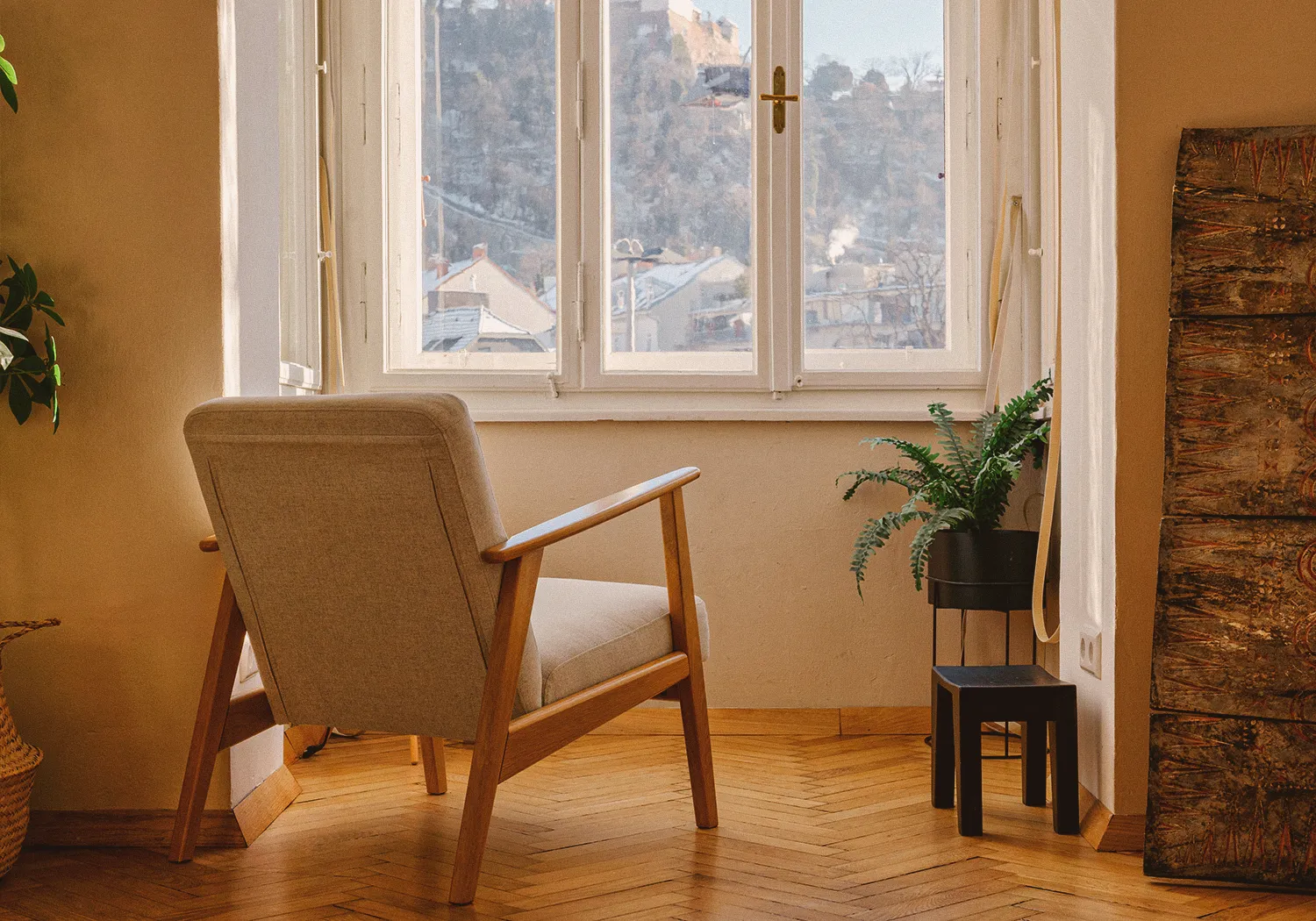 Boutique N°3 • lounge chair by the window with a view of the Schlossberg