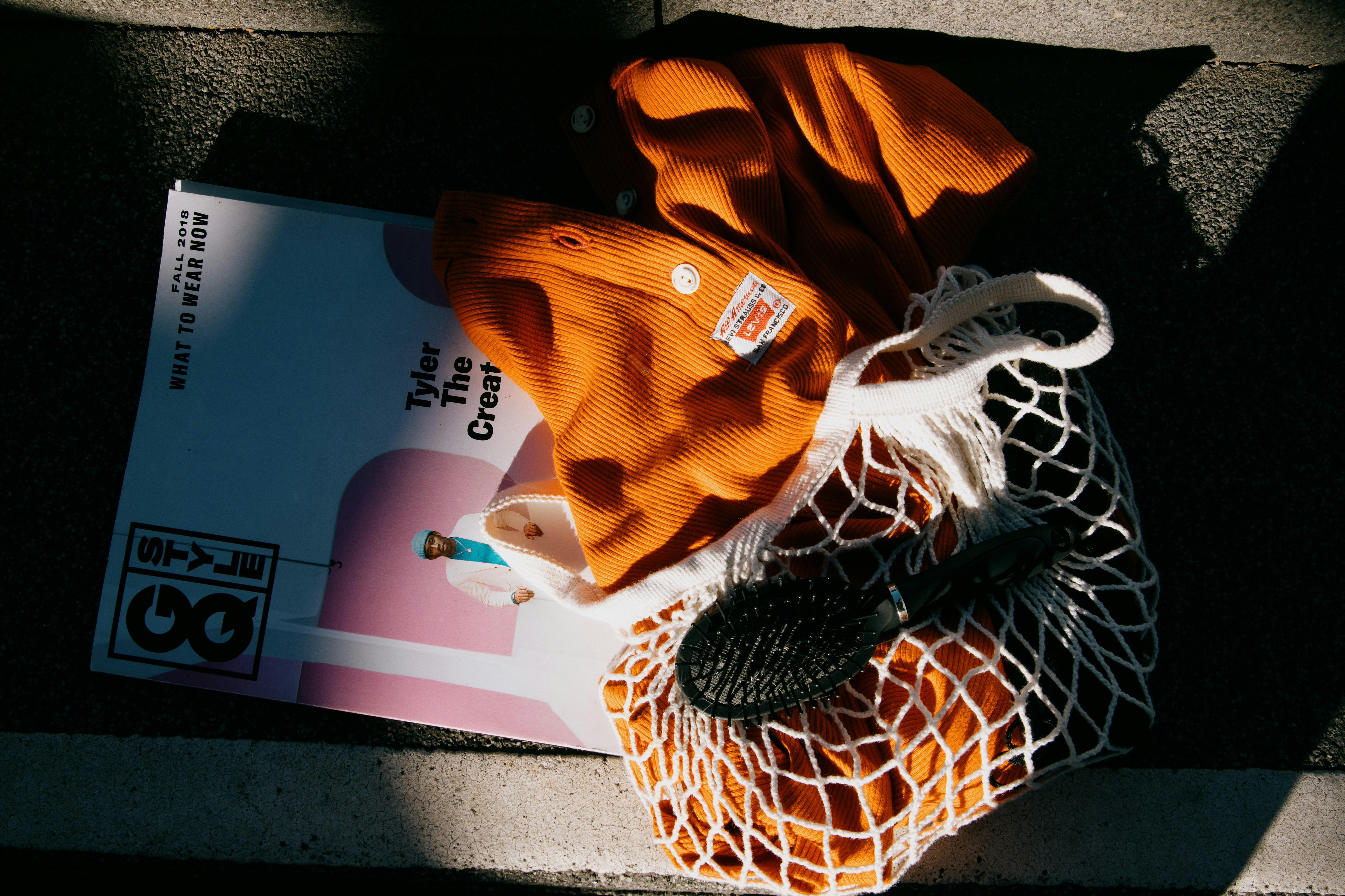 orange and black knit textile