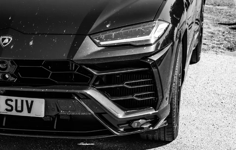 Black Lamborghini Urus front end, close-up exterior shot