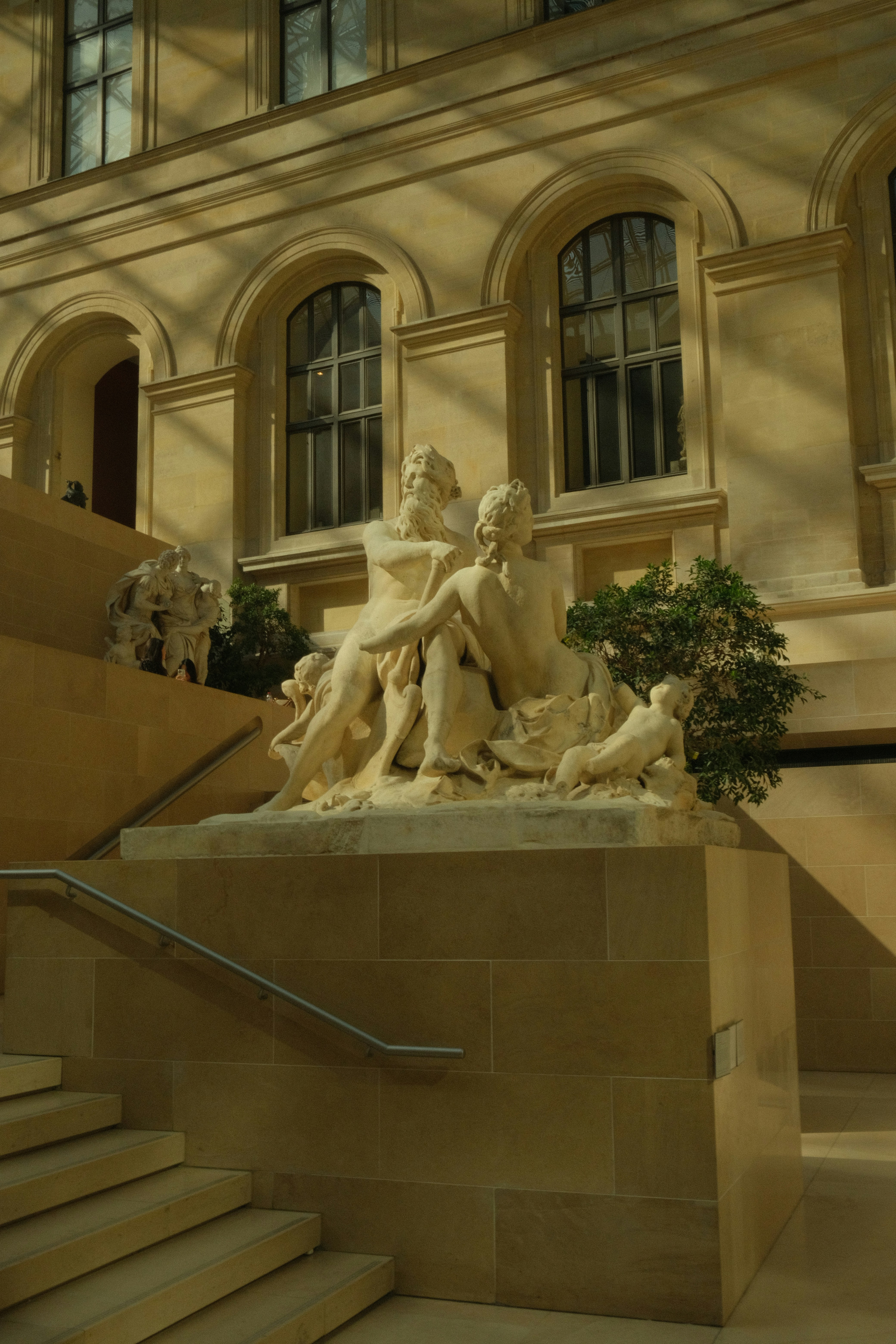 Sculpture of figures on a stone pedestal