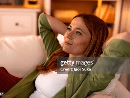 kids lying on a glass land and smiling