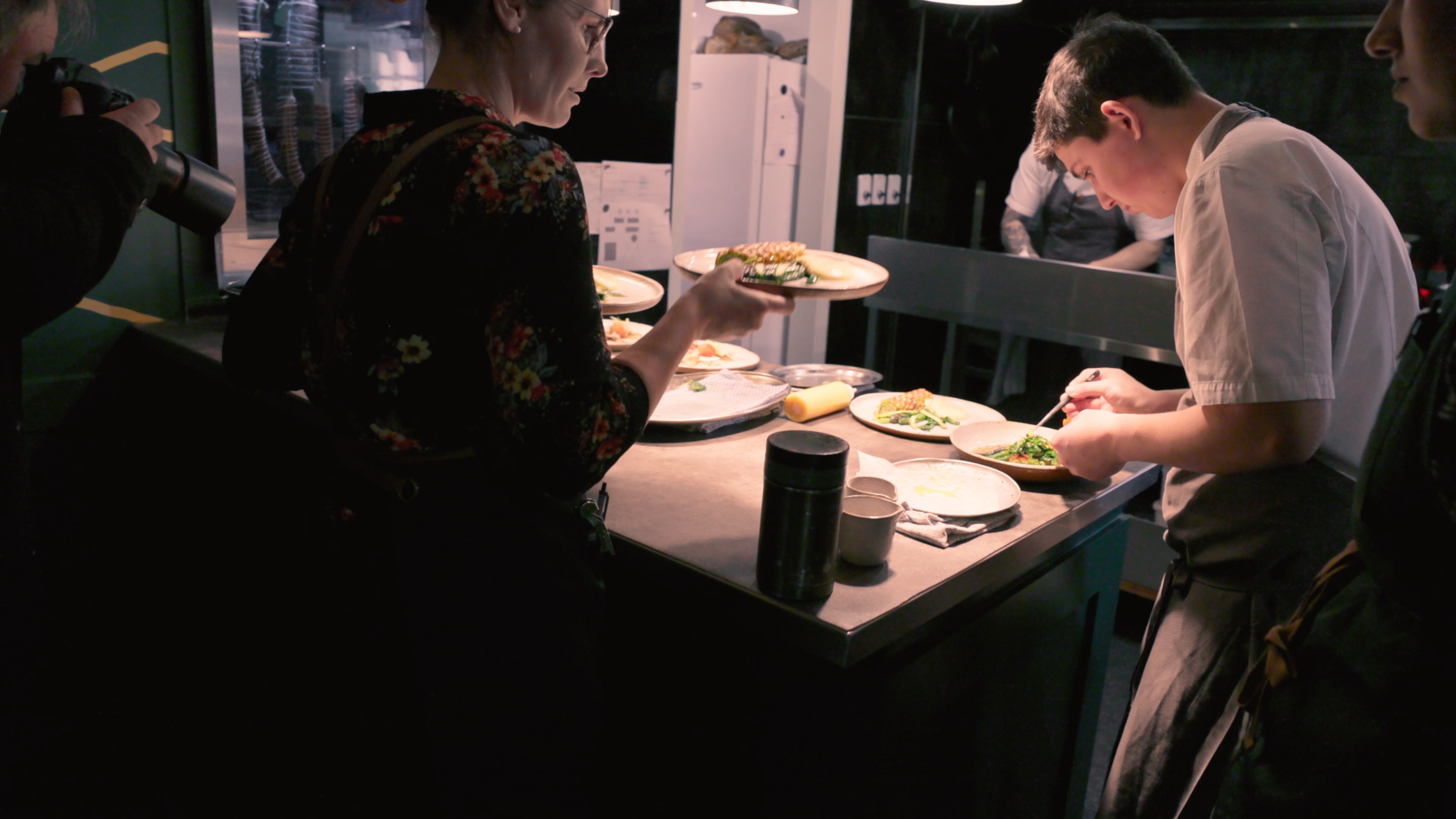 Streetside billboard with flyposters of the Batch.Works brand and illustrations