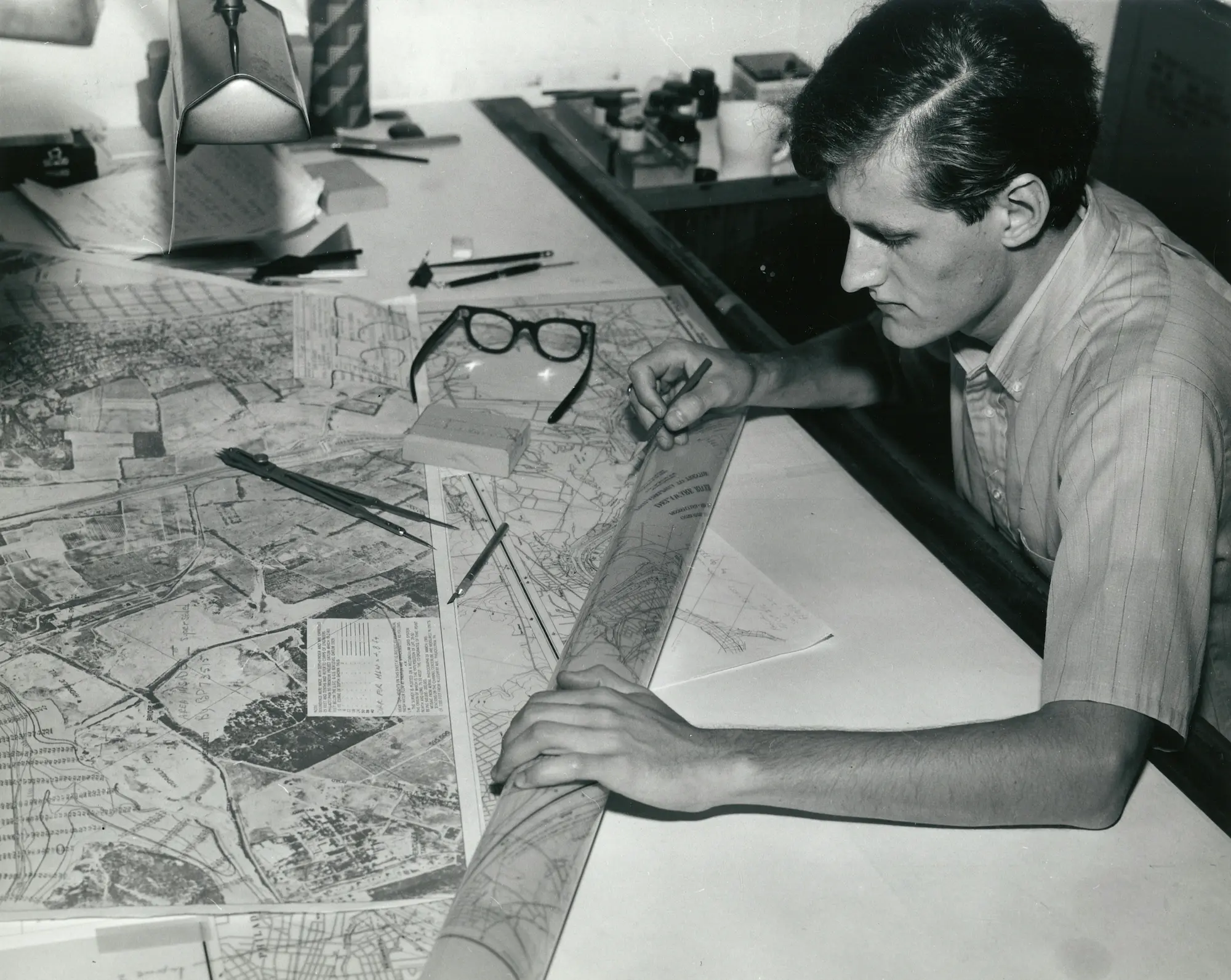 Architecture worker focosing on sketching a building.