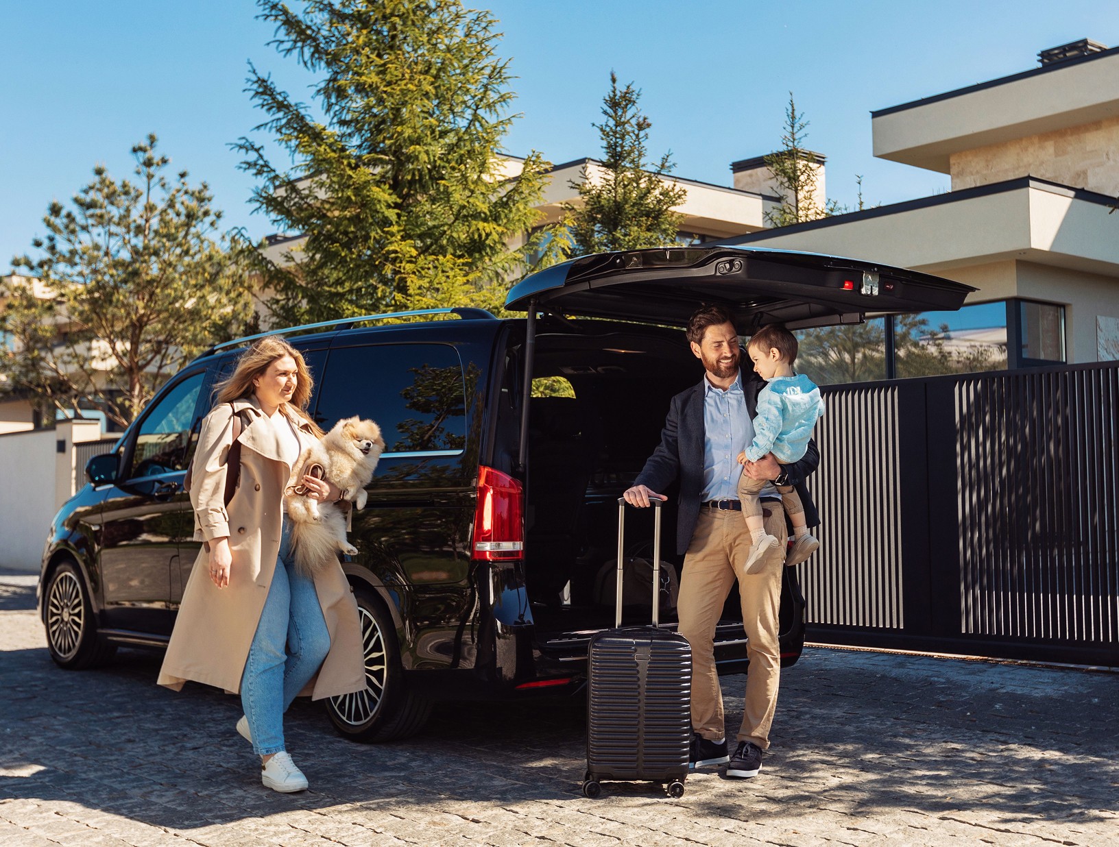 Family arriving with luggage at resort