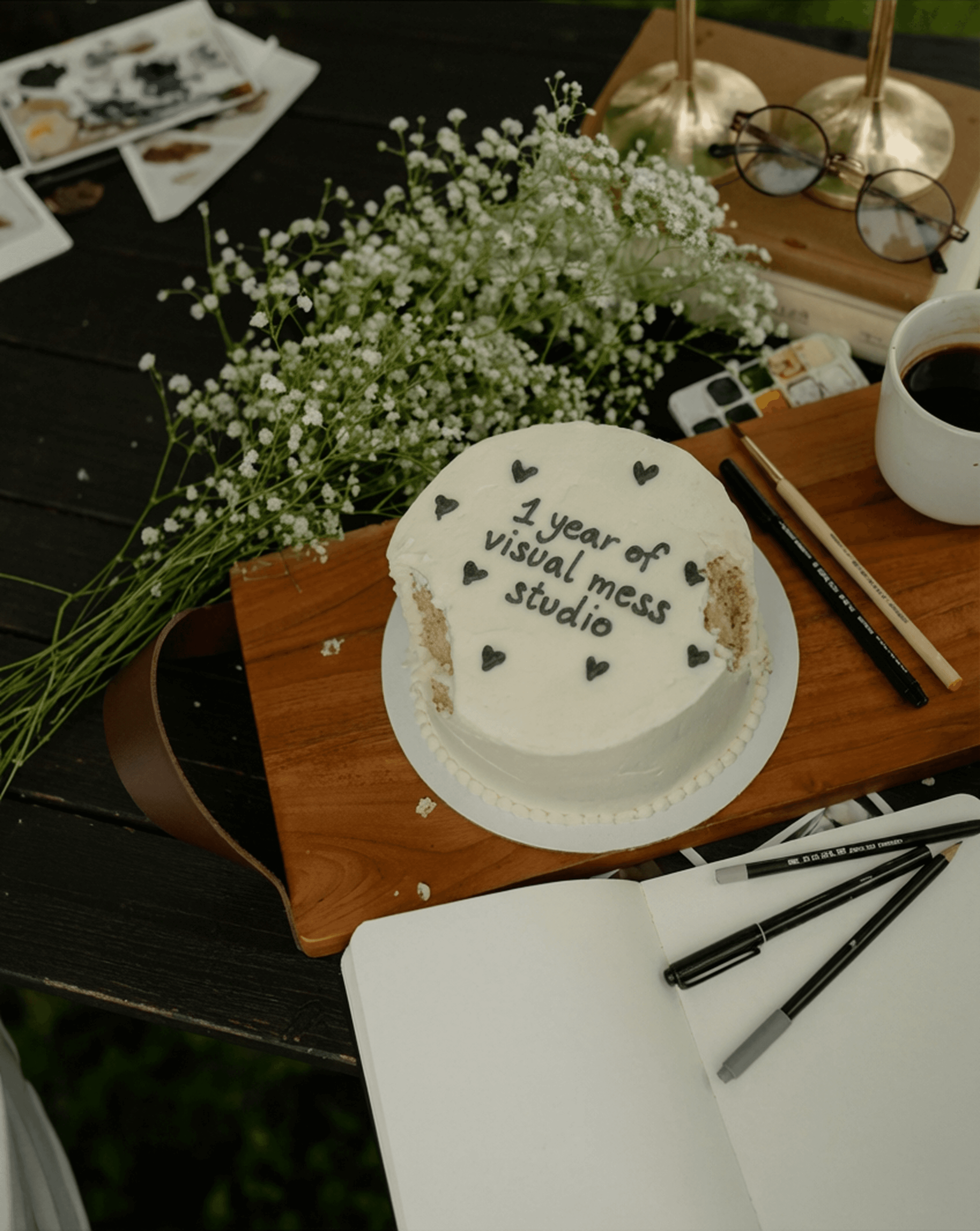 a tablet sitting on a table next to a potted plant
