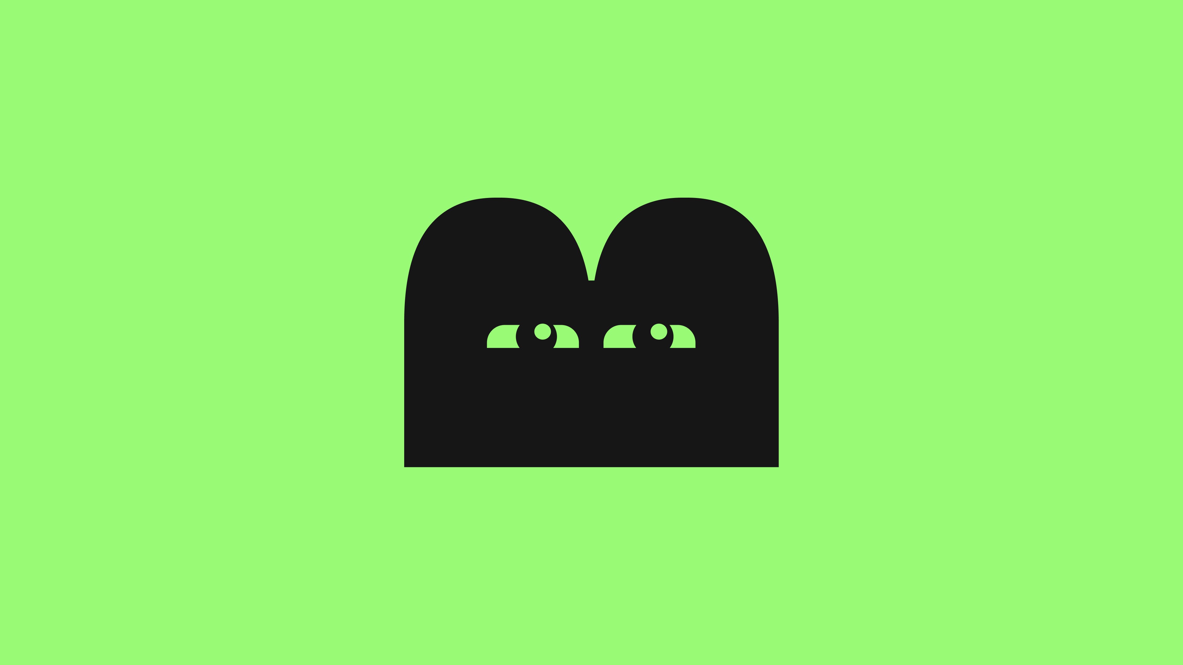 Logomark of a block on green bg