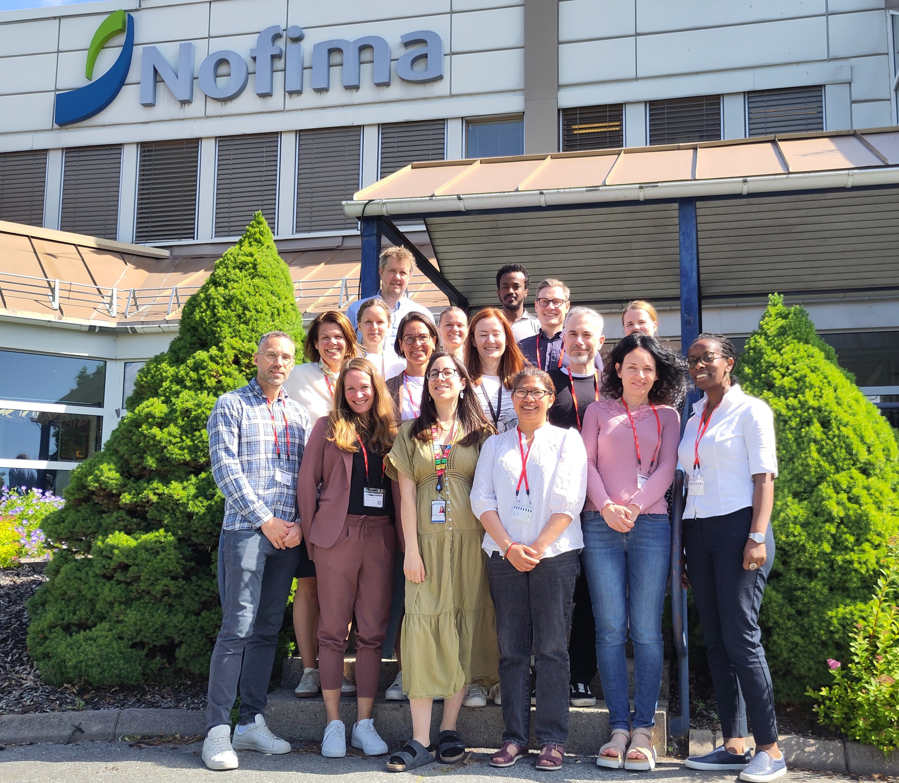 A close-up of a large shell filled with golden grains, resting on a white surface with some food items in the background.