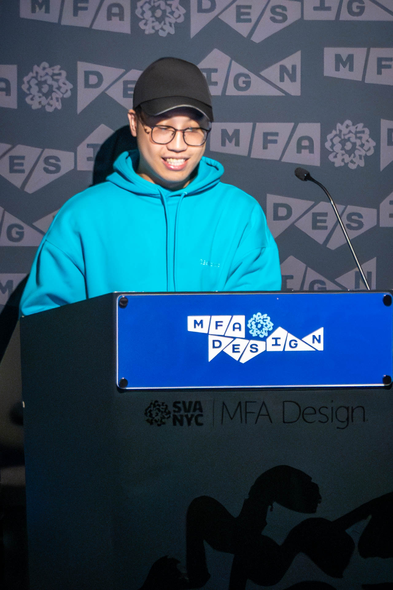 student at a podium giving a presentation
