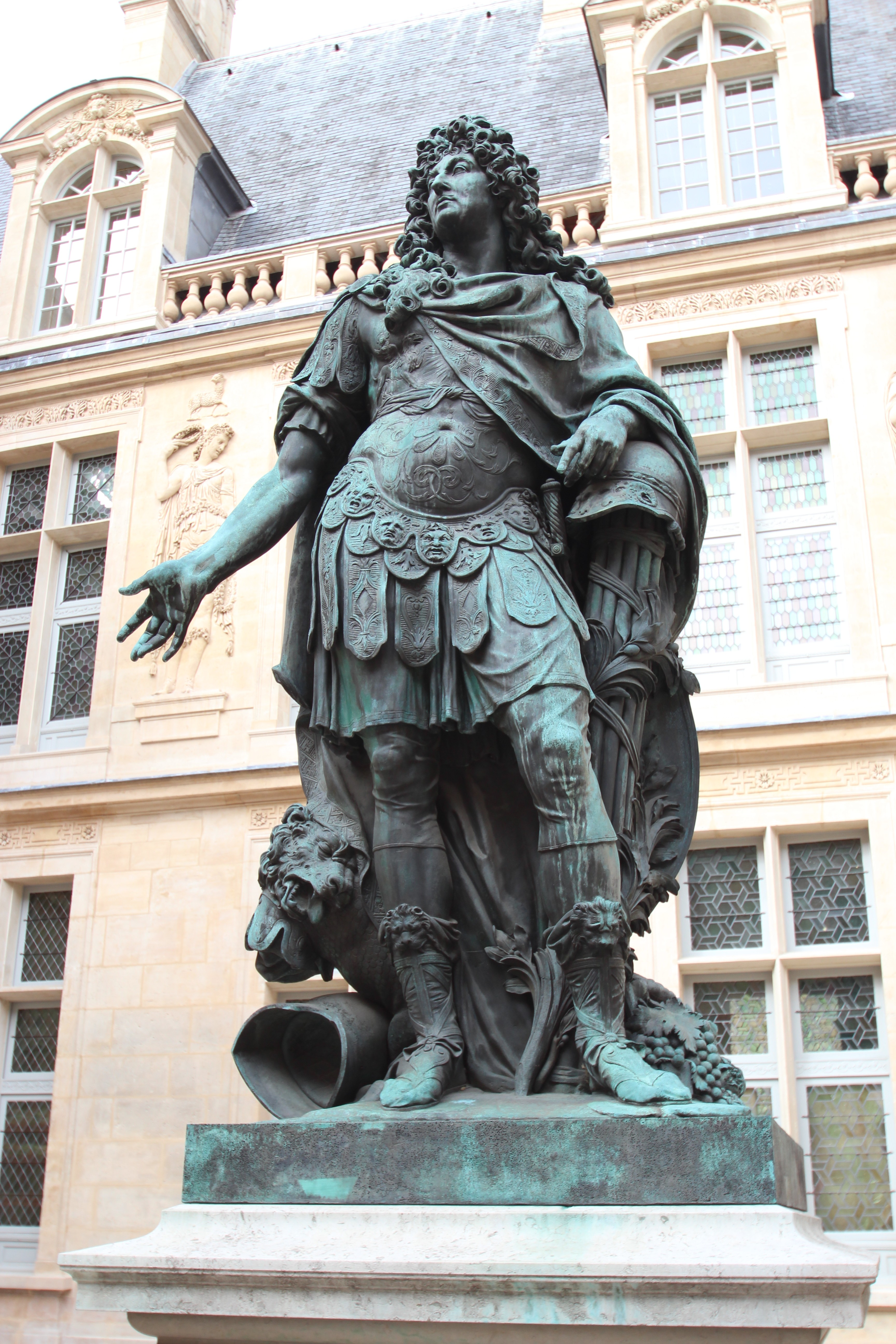 A bronze statue depicting Louis XIV in the costume of a Roman Emperor.