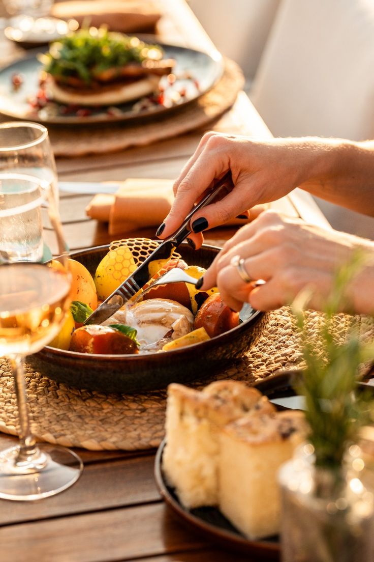 Guest enjoying a beautifully plated dish in soft golden hour lighting at Dhoom, showcasing the restaurant’s seamless dining flow and elevated hospitality atmosphere.