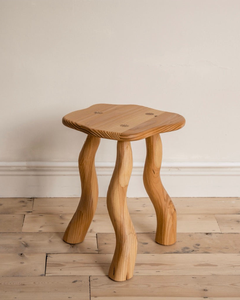 Douglas fir Dancing Stool with carved wavy legs by Wilkinson & Rivera.