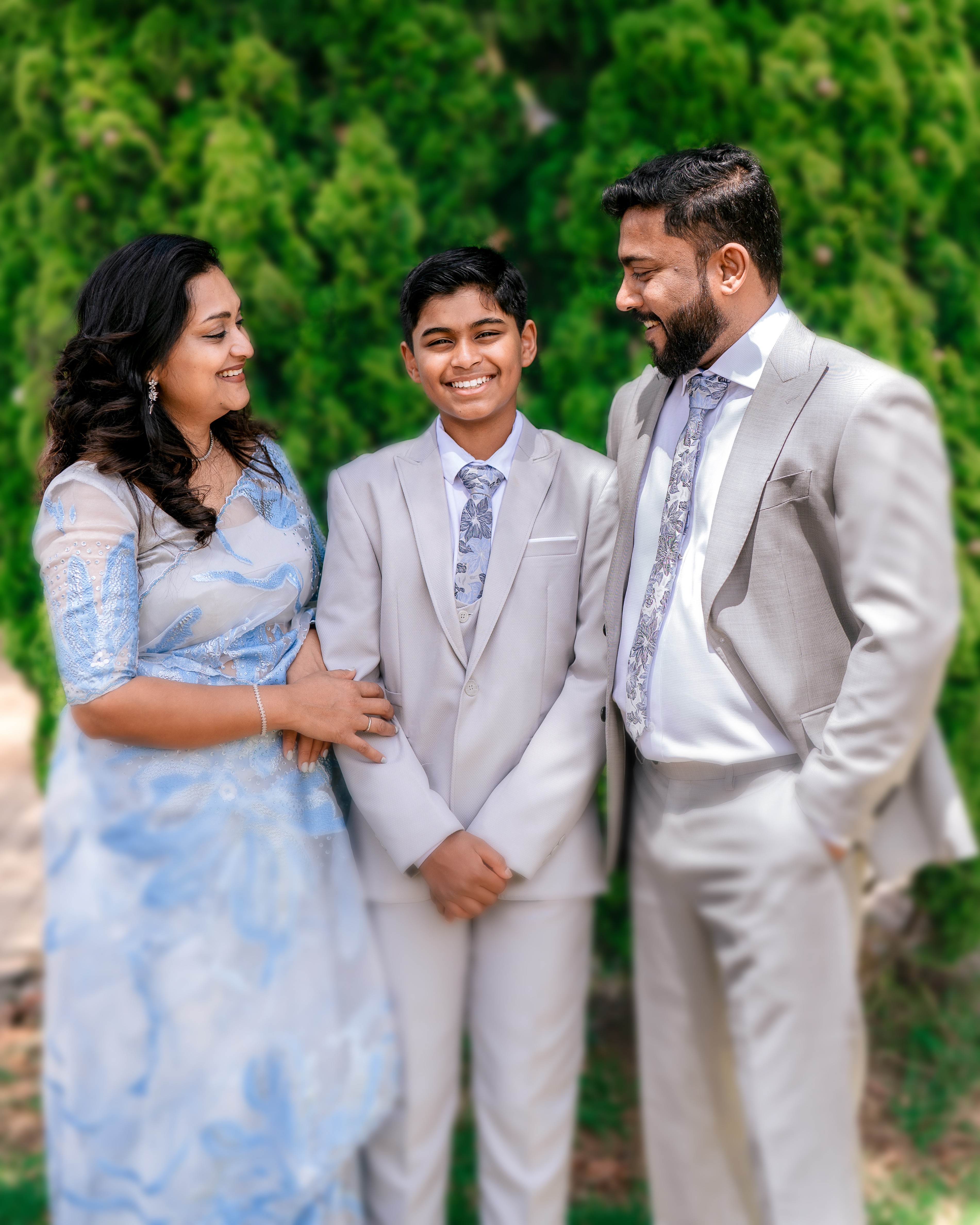 man in blue suit kissing woman in white wedding dress