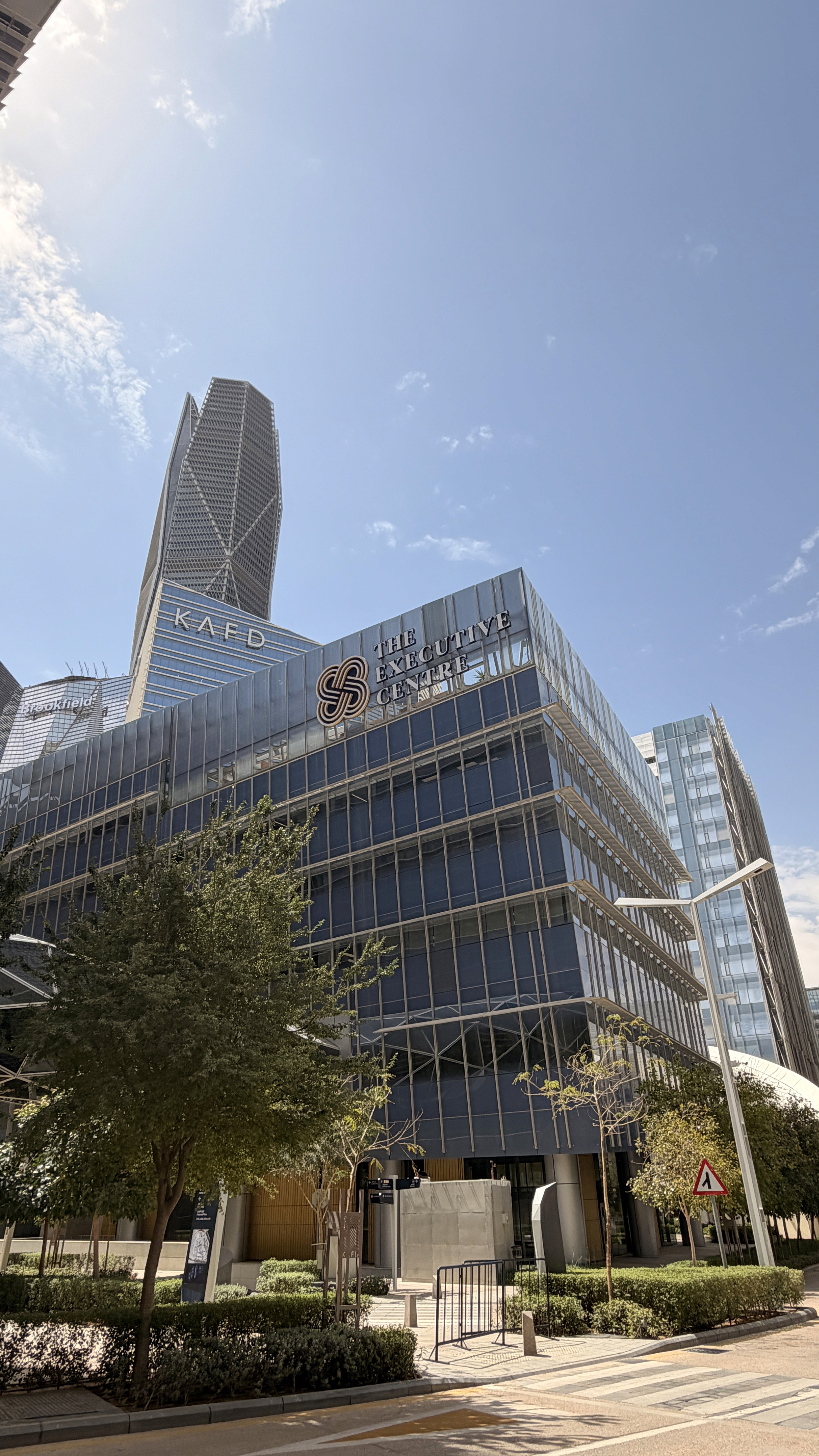 Iconic TEC KSA cityscape with illuminated skyscrapers and sunset gradient sky over urban hub